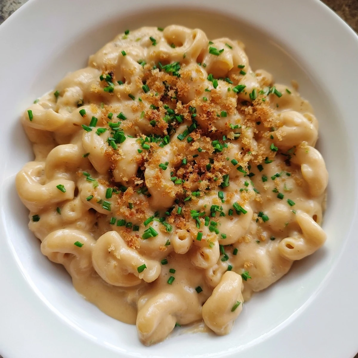 Golden Comfort Food: Creamy Stove-Top Mac and Cheese, bubbling and rich, perfect for a cozy dinner.