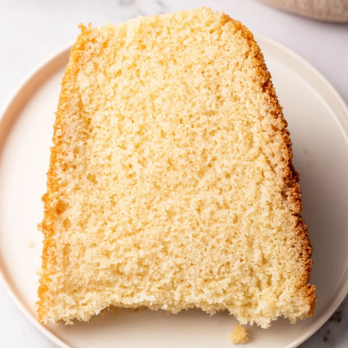 Fluffy, golden Simple 3-Ingredient Vanilla Sponge Cake, perfect for dessert or custom cake decorating.