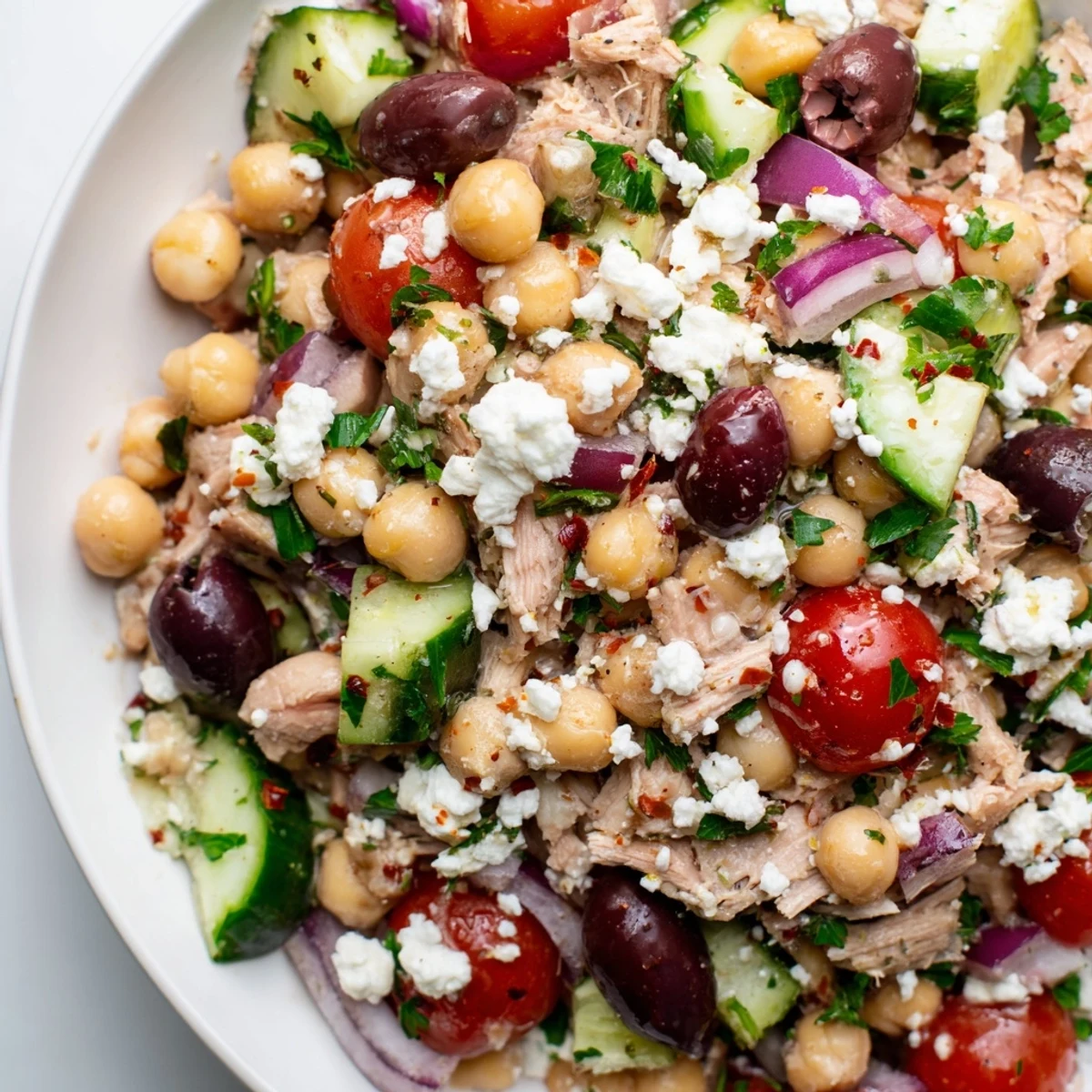 Tuna Chickpea Salad, bursting with fresh flavors, presents a colorful and inviting lunchtime bowl.