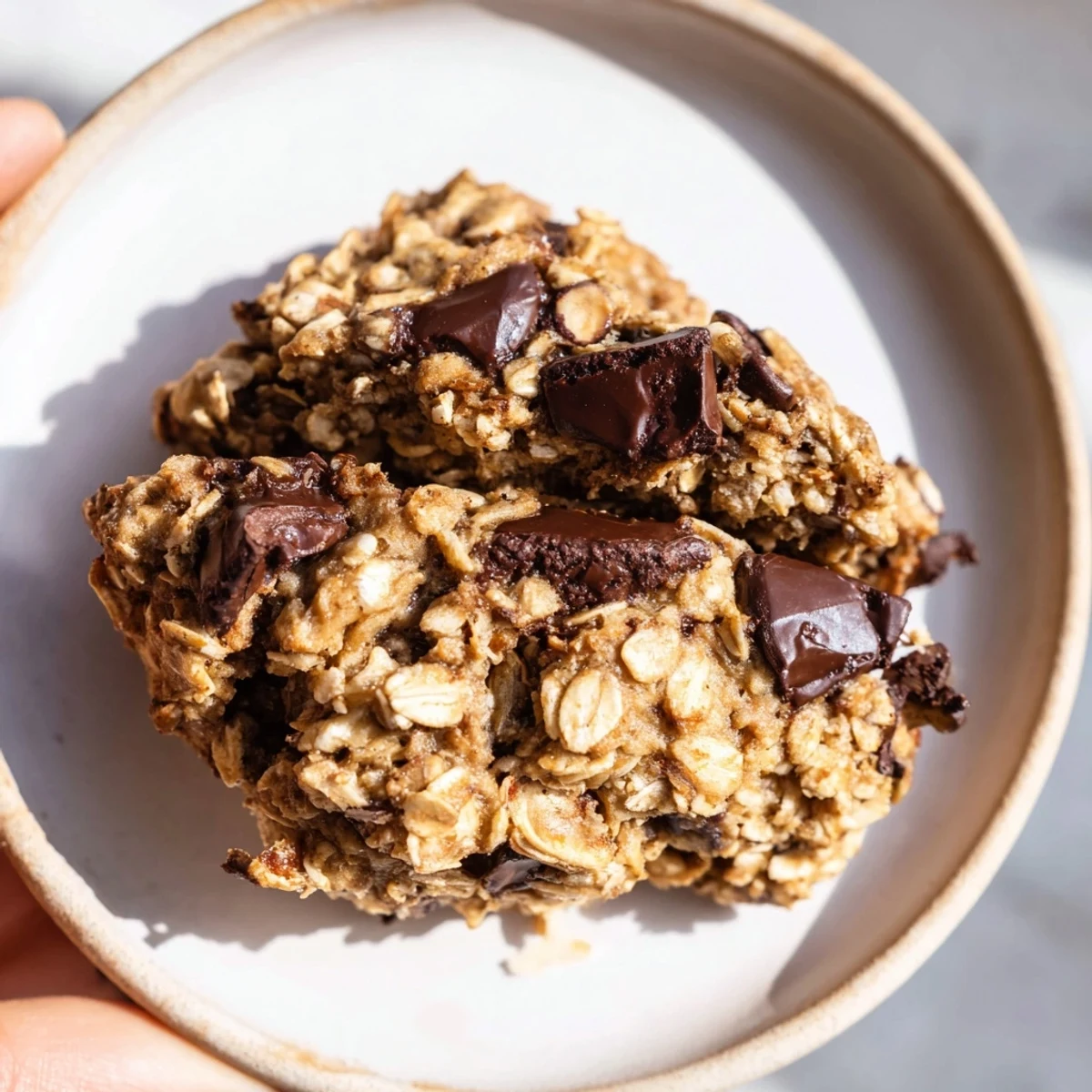 Chewy chocolate oatmeal breakfast cookies with melting chocolate chips, perfect for a quick and easy breakfast.
