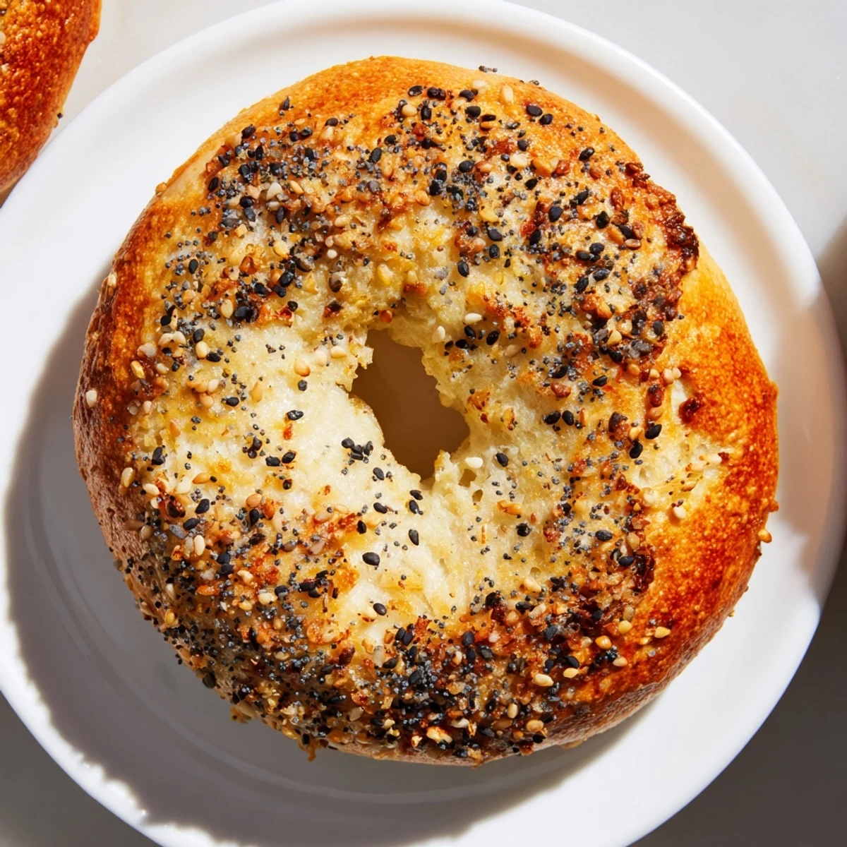 Golden brown Everything Bagel Yogurt Bagels, fresh from the oven, ready for a delicious breakfast spread.