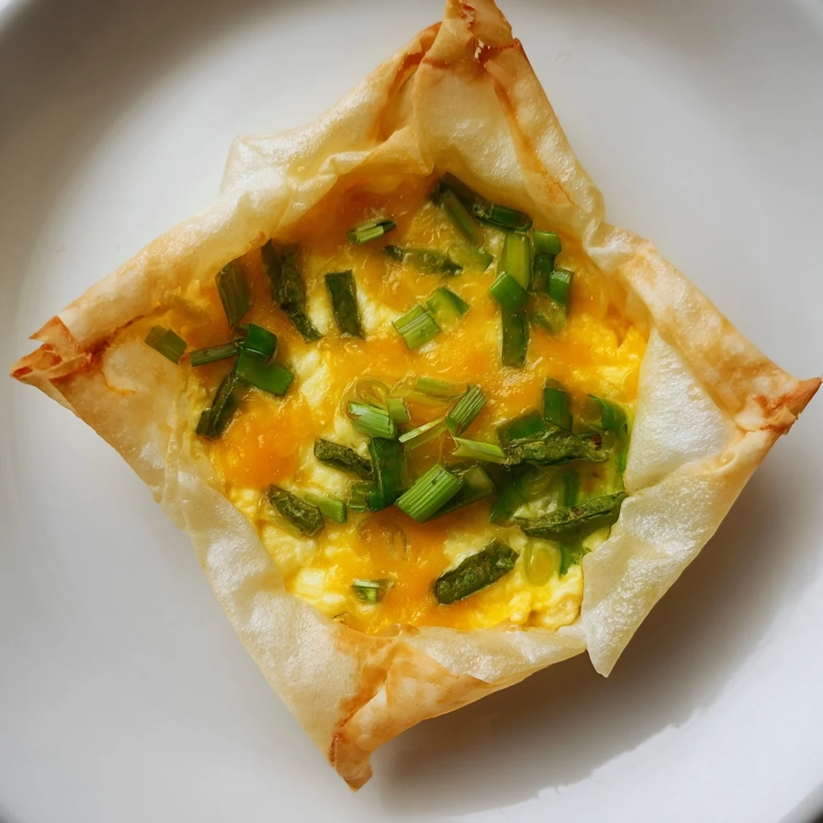 Golden-brown Rice Paper Egg & Cheese Fold, with melted cheese, a simple and satisfying breakfast.
