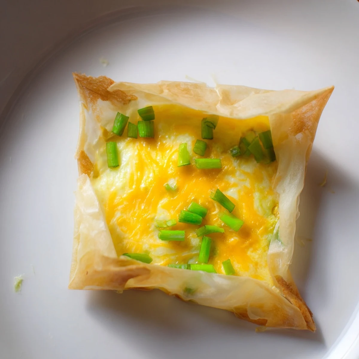 Imagine this: A delicious, quick Rice Paper Egg & Cheese Fold, with a crispy, cheesy center.