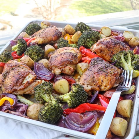 Juicy honey lemon roasted chicken sheet pan dinner served hot with crisp veggies and tangy glaze.