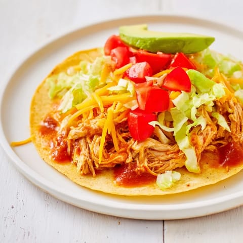 Perfectly cooked, tender slow cooker shredded chicken tacos, brimming with flavorful Mexican spices.
