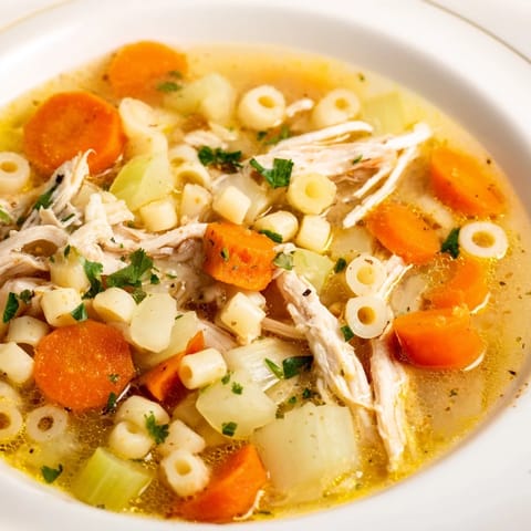 Hearty Chicken and Ditalini Flu Fighter Soup, featuring tender chicken and vibrant vegetables, perfect to soothe.