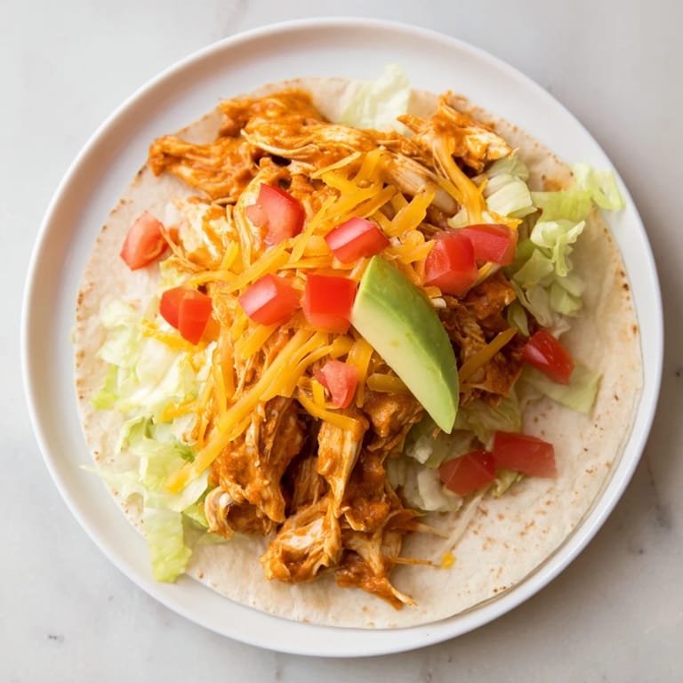 Golden, steaming slow cooker shredded chicken tacos, perfect for a family dinner tonight.