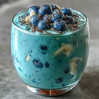 Creamy Probiotic Kefir Smoothie with vibrant blueberries and flaxseed swirl.